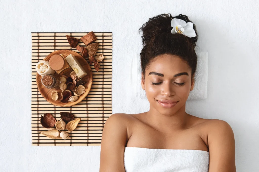 peaceful black girl having aromatherapy at spa.jpg